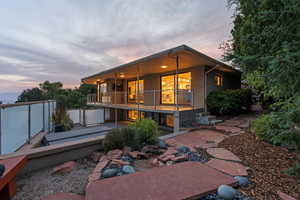 Rear view of property featuring stucco siding