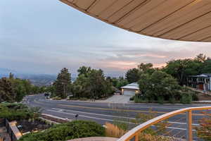 Balcony featuring view of scattered trees