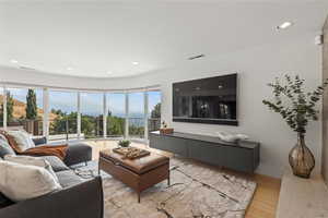 Living area featuring recessed lighting and light wood-style floors