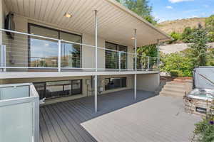 Wooden deck featuring a patio