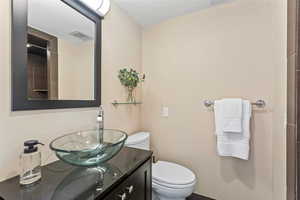 Full bathroom with vanity and toilet