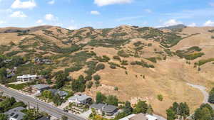 Aerial overview of property's location with a mountain backdrop