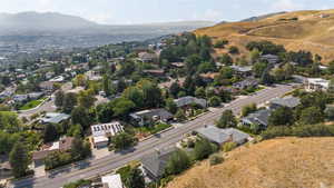 View of property location featuring a mountain backdrop and nearby suburban area