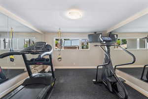 Exercise room featuring baseboards