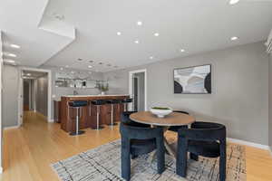 Dining room featuring recessed lighting and light wood-type flooring
