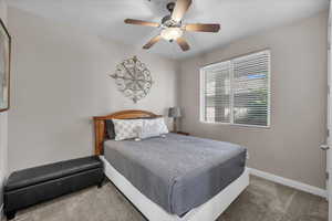 Bedroom featuring carpet flooring and a ceiling fan