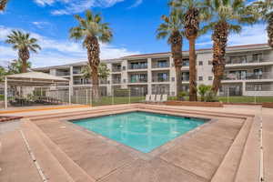 Community pool with a patio and a gazebo