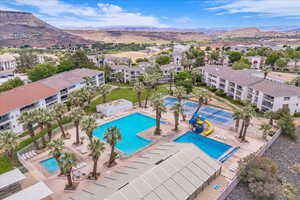 Community pool featuring a mountain view and a patio area