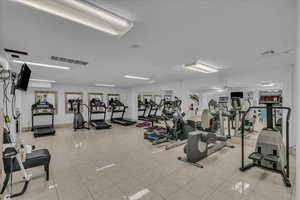 Gym featuring light tile patterned floors
