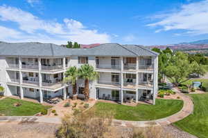 View of apartment building / complex featuring a mountain view
