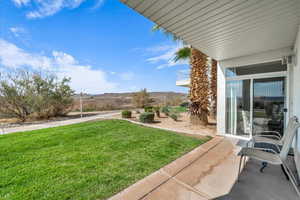 View of grassy yard with a mountain view