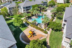 Aerial view of residential area featuring a pool