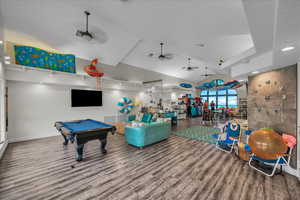 Game room featuring ceiling fan, wood finished floors, pool table, and track lighting