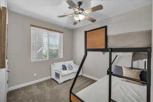 Bedroom featuring carpet floors and a ceiling fan