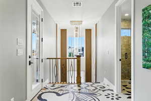 Hallway with dramatic tile.