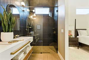 Bathroom with a dramatic stall shower and double vanity
