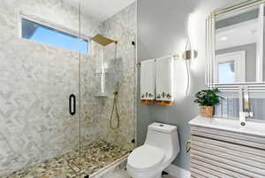 Bathroom with a stall shower and vanity