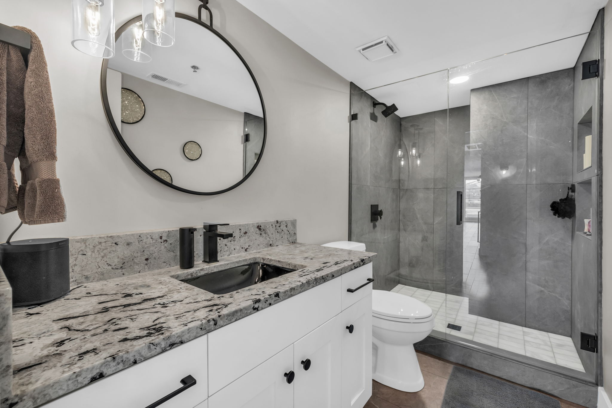 Bathroom with vanity and a stall shower