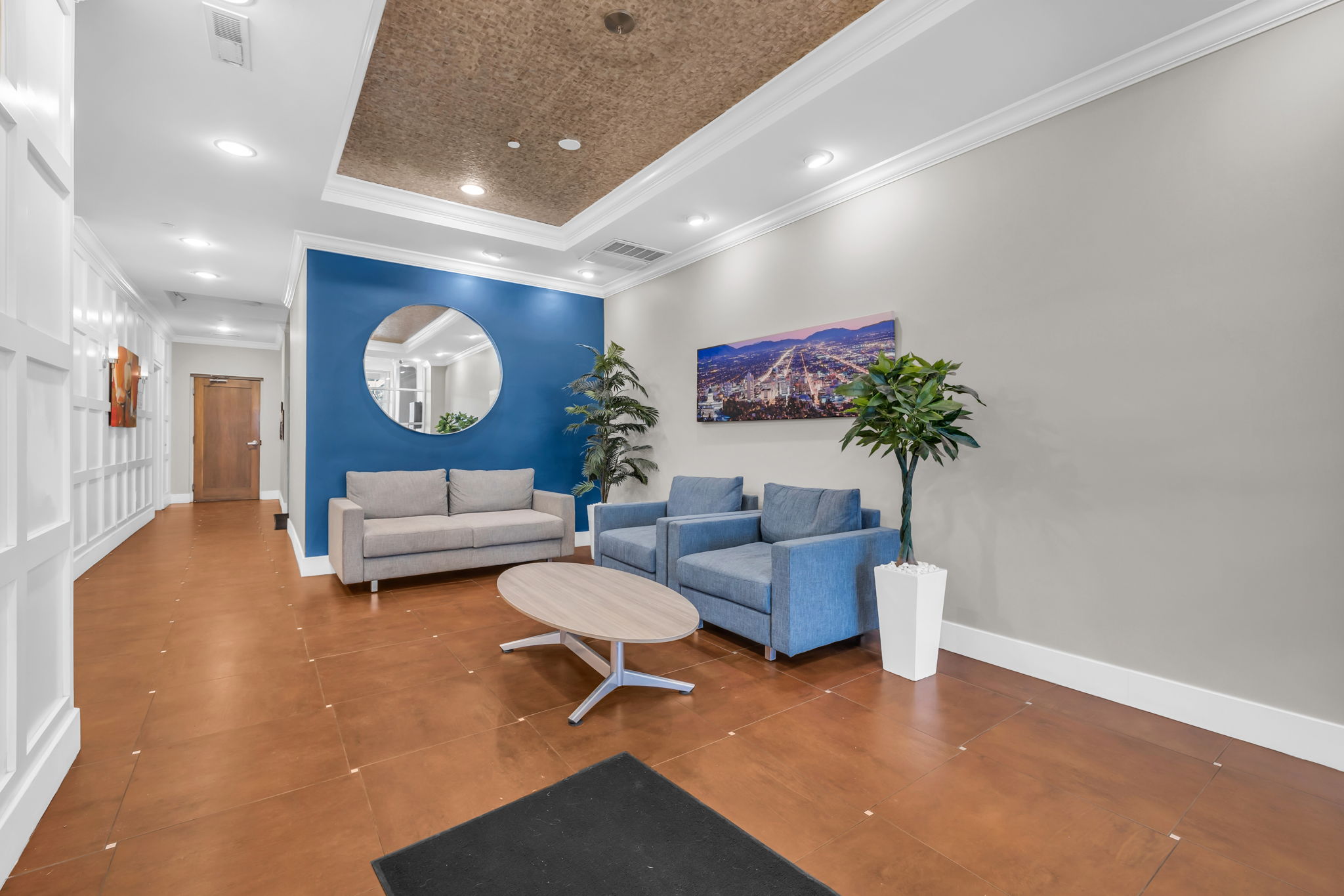 Building lobby with crown molding and recessed lighting
