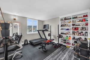 Workout area featuring baseboards