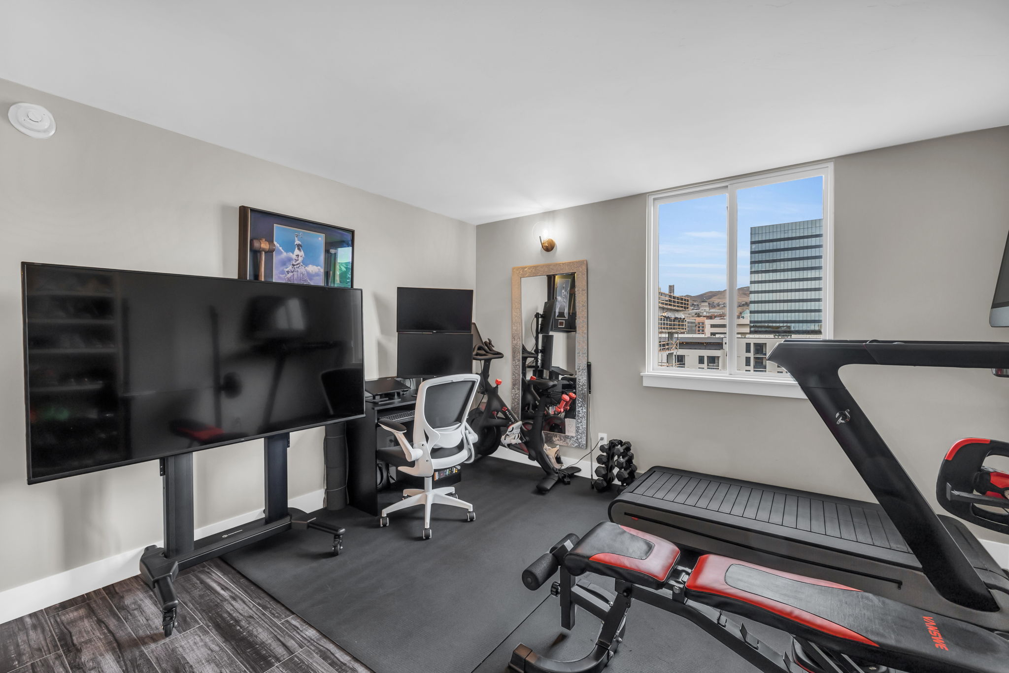 Exercise area featuring baseboards and carpet