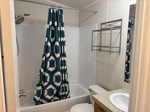 Bathroom featuring shower / tub combo and vanity
