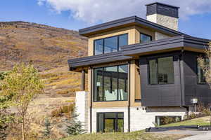 View of front of home with a chimney