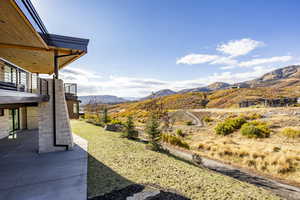 View of yard with a mountain view and a patio area