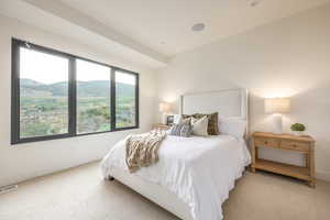 Bedroom with carpet flooring and a mountain view
