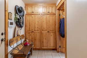 Mudroom featuring light tile patterned floors