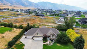 Aerial view of residential area featuring a mountainous background