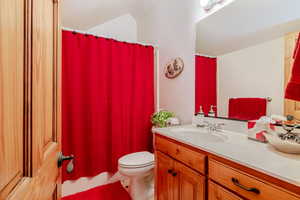 Bathroom featuring vanity and toilet
