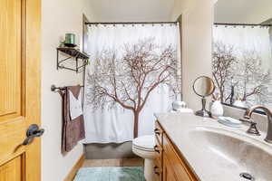 Bathroom with vanity and light tile patterned floors