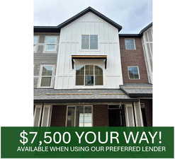 View of front of property with board and batten siding and brick siding
