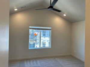 Carpeted spare room with lofted ceiling, recessed lighting, a ceiling fan, and a textured ceiling
