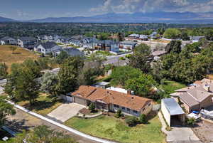 Aerial view of residential area with a mountainous background