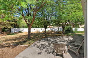 Fenced backyard with a patio area