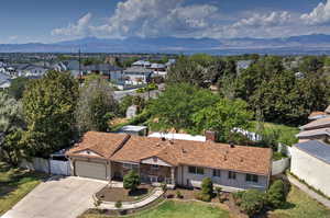 Aerial view of residential area featuring a mountain backdrop
