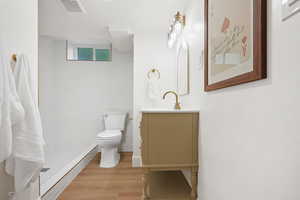 Bathroom with vanity and light wood-style flooring