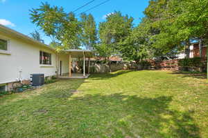 Fenced backyard featuring a patio area