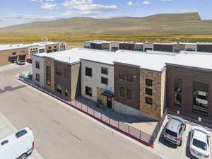 Contemporary home featuring a mountain view and stone siding