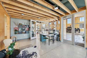 Dining room with healthy amount of natural light and speckled floor