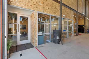 Property entrance with a patio