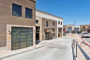 View of building exterior featuring driveway