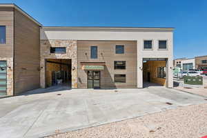 Modern home with stone siding and stucco siding