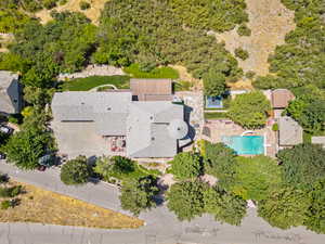 Aerial view of property and surrounding area with a pool
