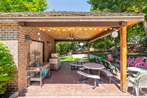 View of patio with ceiling fan