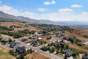 Aerial perspective of suburban area with a mountain backdrop