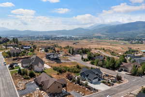 Aerial view of residential area featuring mountains