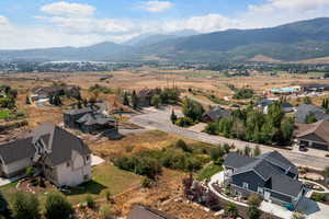Aerial perspective of suburban area with a mountain backdrop
